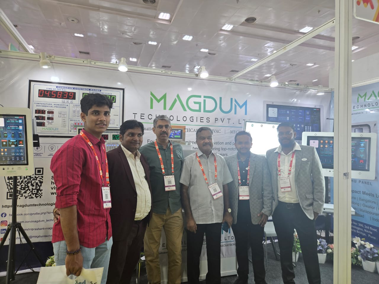 Visitors and the Magdum team at the booth